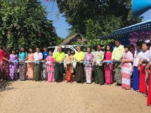 Guests at the ceremony wearing traditional Burmese garments